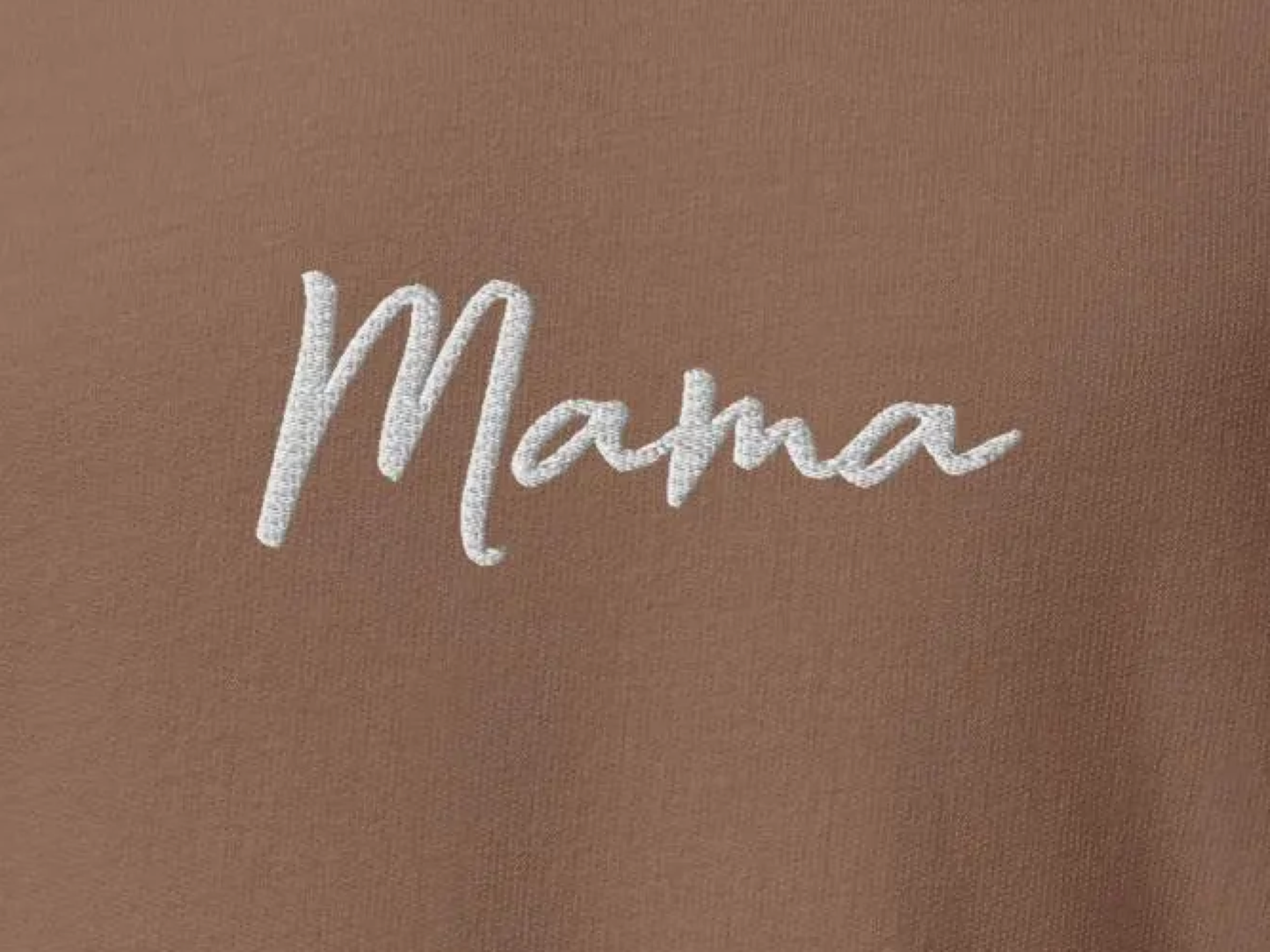 Close-up of white MAMA embroidery on Espresso sweatshirt